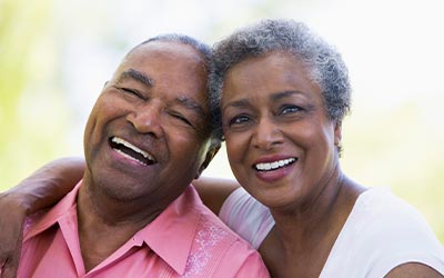 couple with dentures smiling
