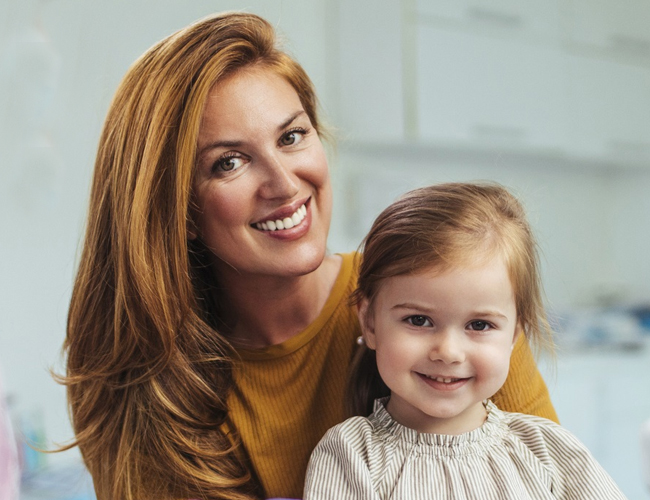Kid with her mother - pediatric dentistry - Cascade Dental Care